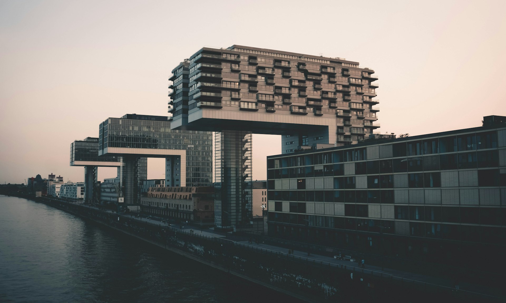black and brown concrete building near body of water during daytime
